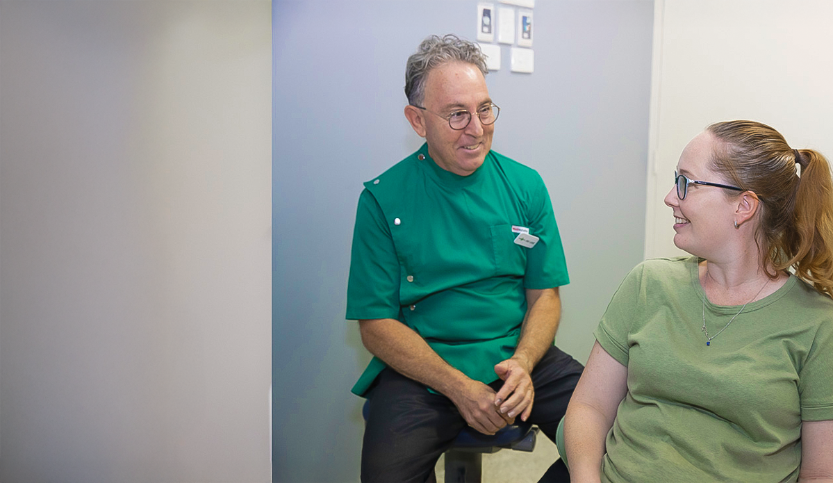 Dr Luke talking with a patient