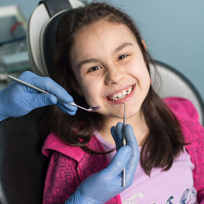 Little girl having her teeth cleaned at Princeton Dental