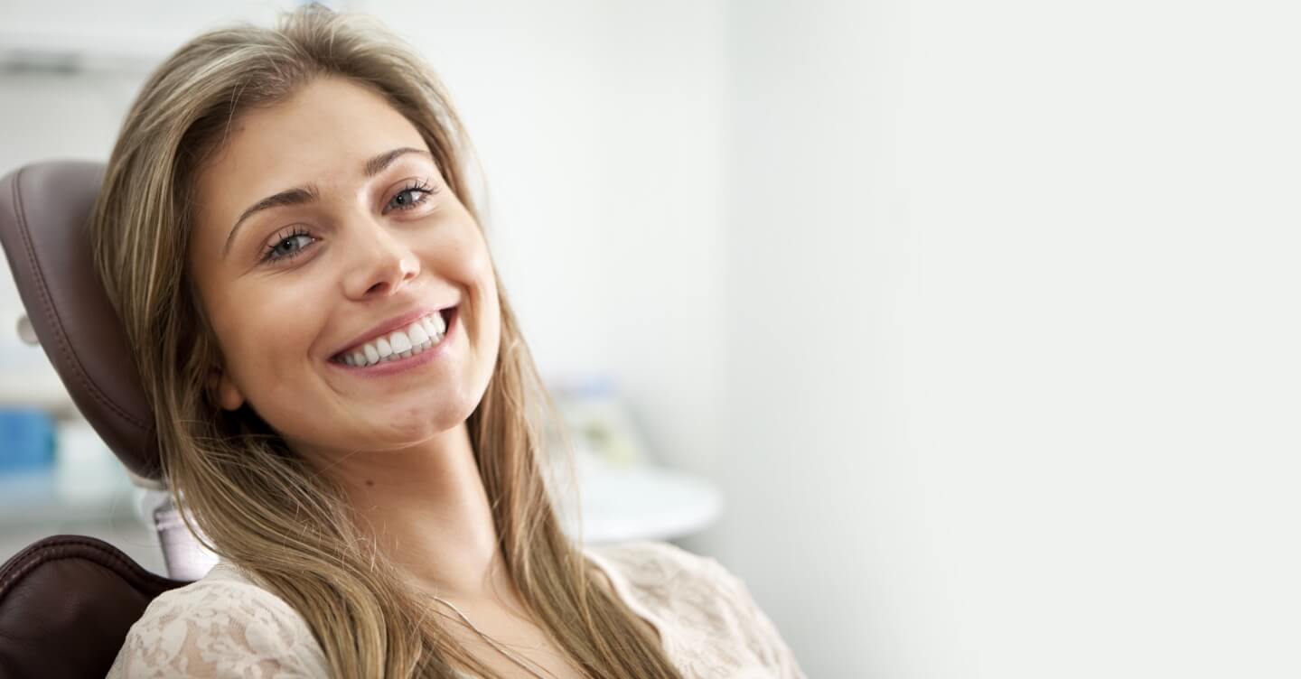 Smiling patient in the dental chair